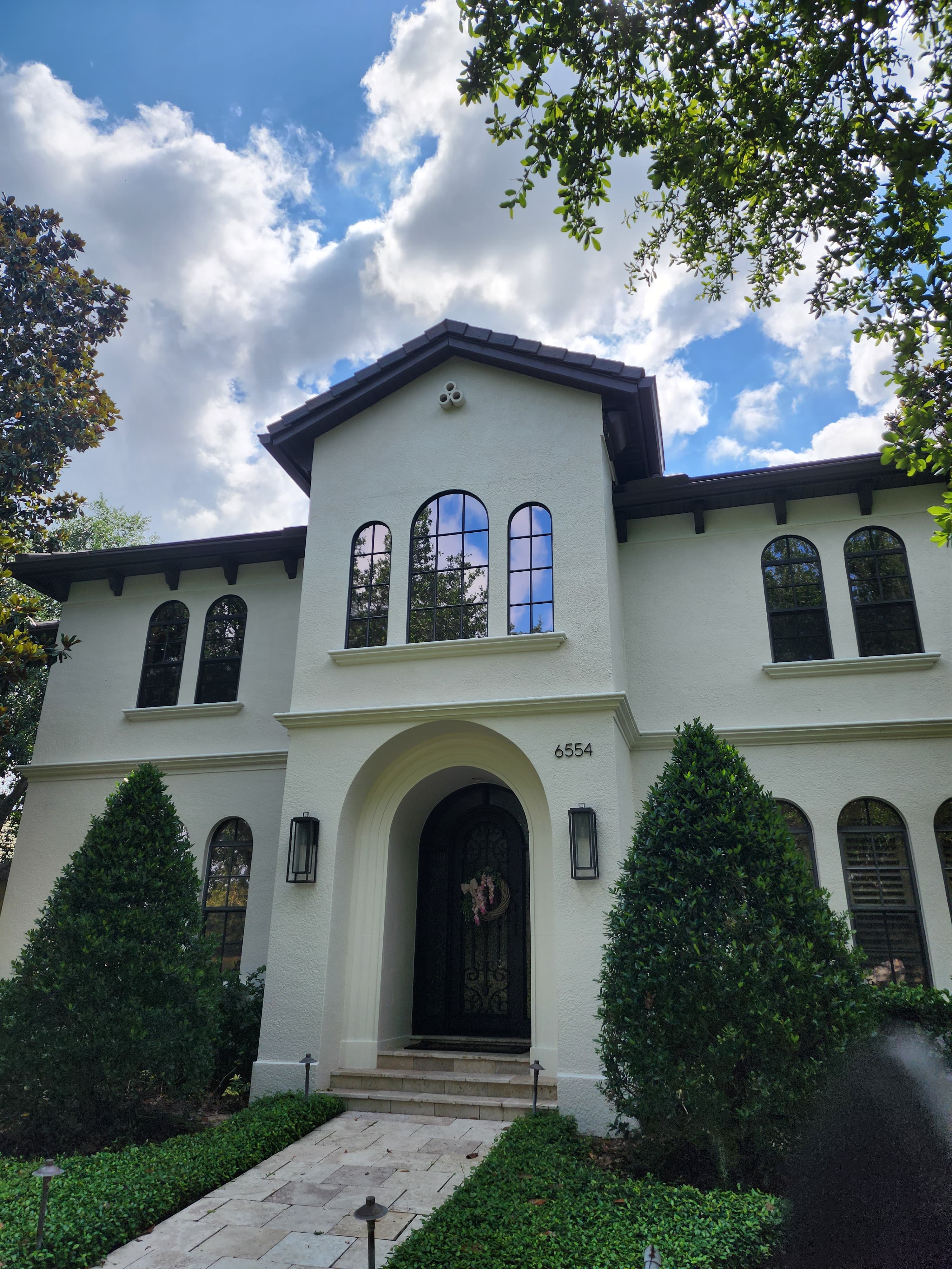 Spanish style home with foam arched window surrounds